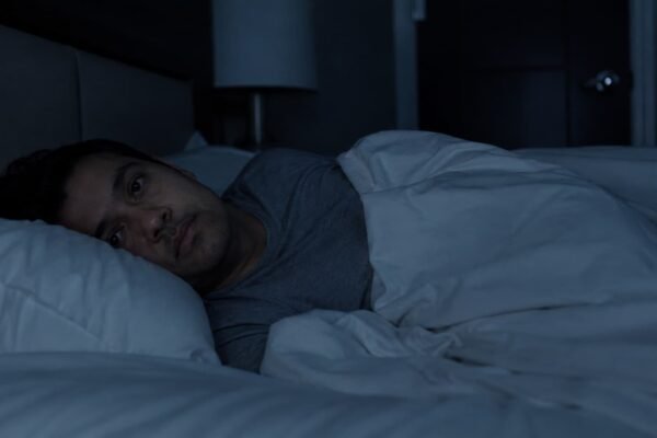 person awake during sleep paralysis at night